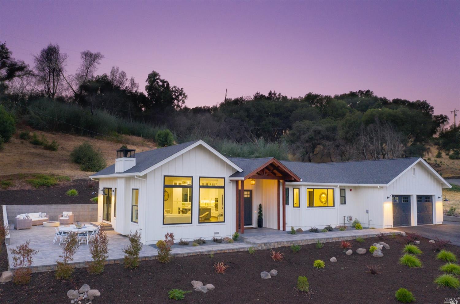 4949 Wikiup Bridge Way Santa Rosa, CA 95404 - Photo 1 of 1 a front view of a house with a yard and garage
