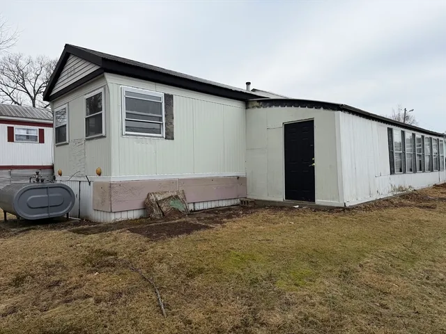 a front view of a house with parking space