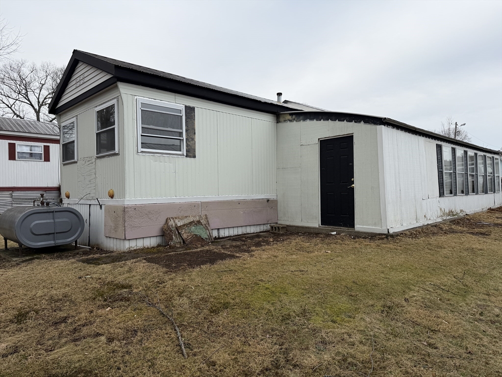 181 Boston Post Road East, Unit 26 Marlborough, MA 01752 - Photo 14 of 14 a front view of a house with parking space