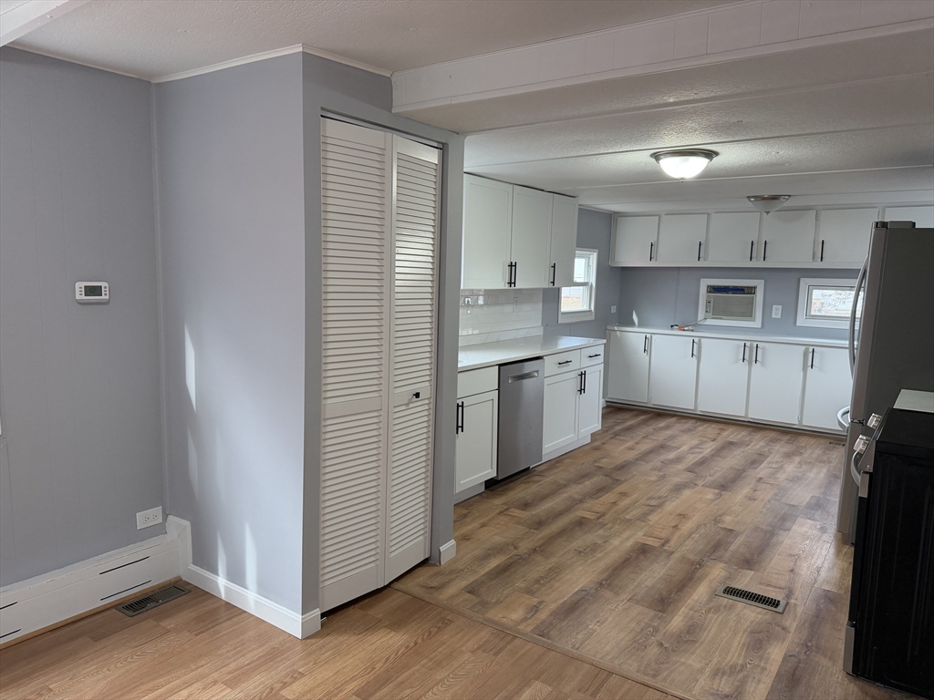 181 Boston Post Road East, Unit 26 Marlborough, MA 01752 - Photo 4 of 14 a kitchen with a sink window and cabinets