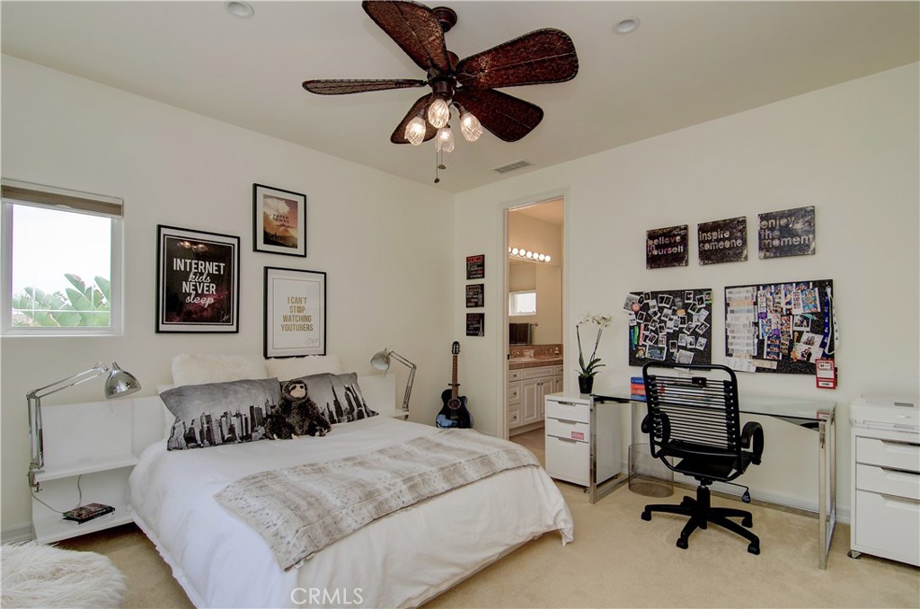 21 Asilomar Road Laguna Niguel, CA 92677 - Photo 15 of 35 a bedroom with a bed gym equipment and view of living room