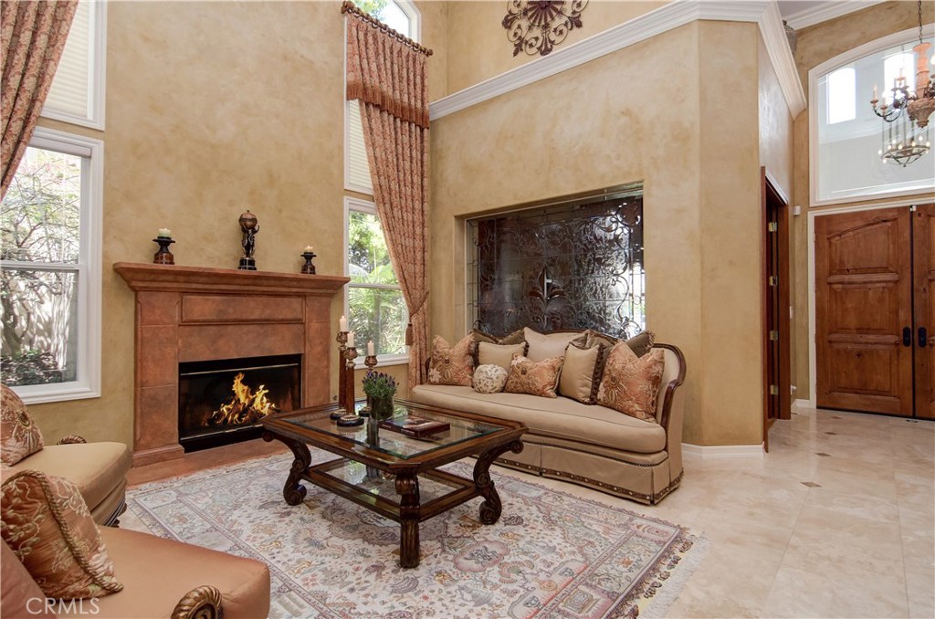 21 Asilomar Road Laguna Niguel, CA 92677 - Photo 20 of 35 a living room with furniture and a fireplace