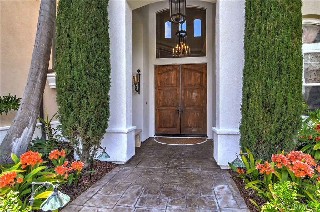 21 Asilomar Road Laguna Niguel, CA 92677 - Photo 22 of 35 a front view of a house with a yard and flowers