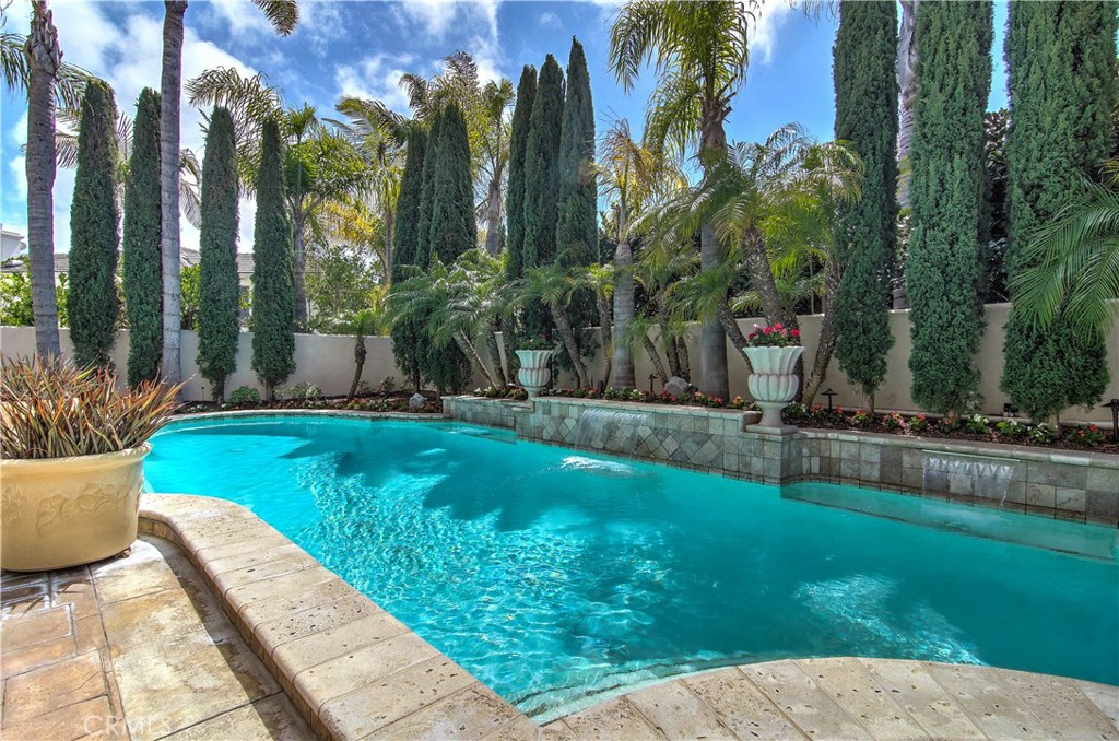 21 Asilomar Road Laguna Niguel, CA 92677 - Photo 4 of 35 a view of a backyard with potted plants and palm trees