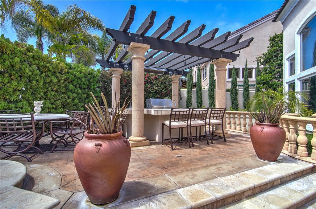 21 Asilomar Road Laguna Niguel, CA 92677 - Photo 5 of 35 a view of a patio with couches chairs and potted plants