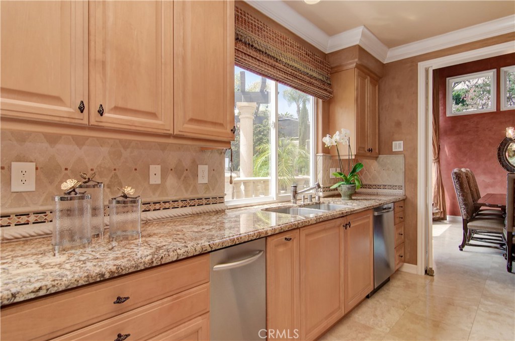 21 Asilomar Road Laguna Niguel, CA 92677 - Photo 7 of 35 a kitchen with stainless steel appliances granite countertop sink and cabinets