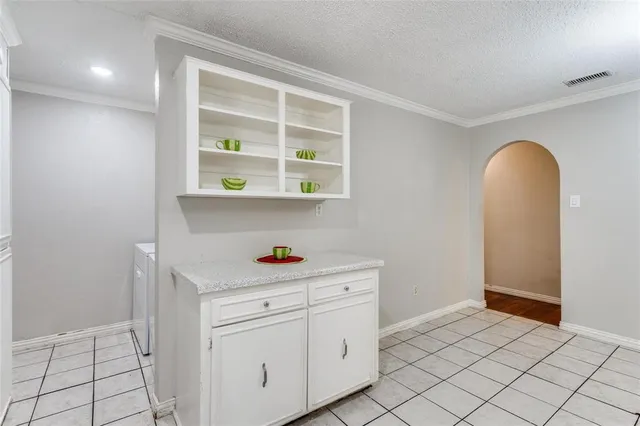 a view of cabinets and wooden floor