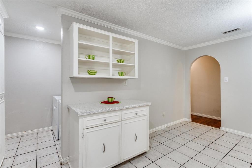 1708 Hendrick Drive Plano, TX 75074 - Photo 11 of 23 a view of cabinets and wooden floor
