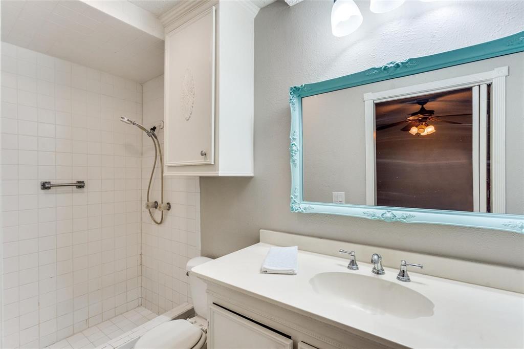1708 Hendrick Drive Plano, TX 75074 - Photo 14 of 23 a bathroom with a sink a toilet and shower