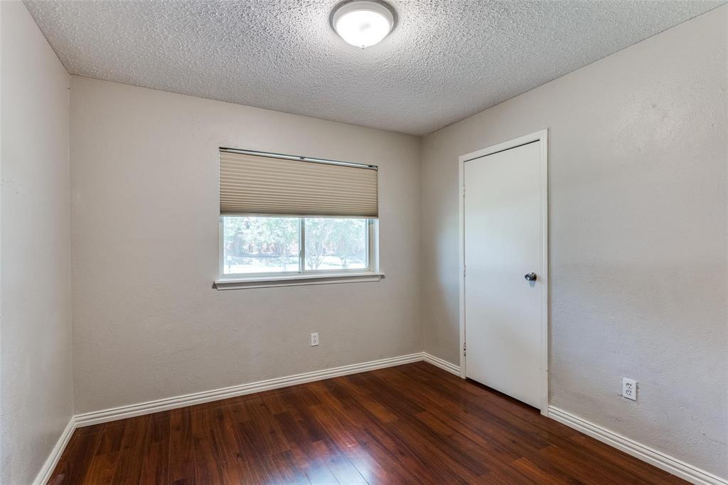 1708 Hendrick Drive Plano, TX 75074 - Photo 15 of 23 an empty room with wooden floor and windows