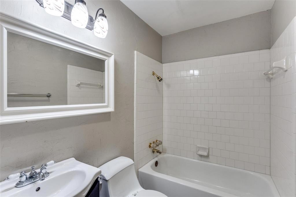 1708 Hendrick Drive Plano, TX 75074 - Photo 17 of 23 a bathroom with a sink a toilet and shower