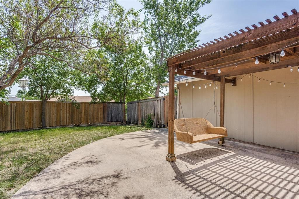 1708 Hendrick Drive Plano, TX 75074 - Photo 19 of 23 a chair and table in a backyard