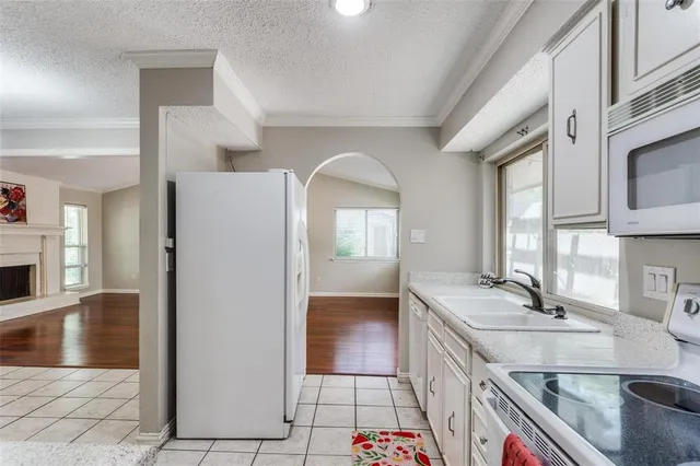 a bathroom with a sink a vanity and a large mirror