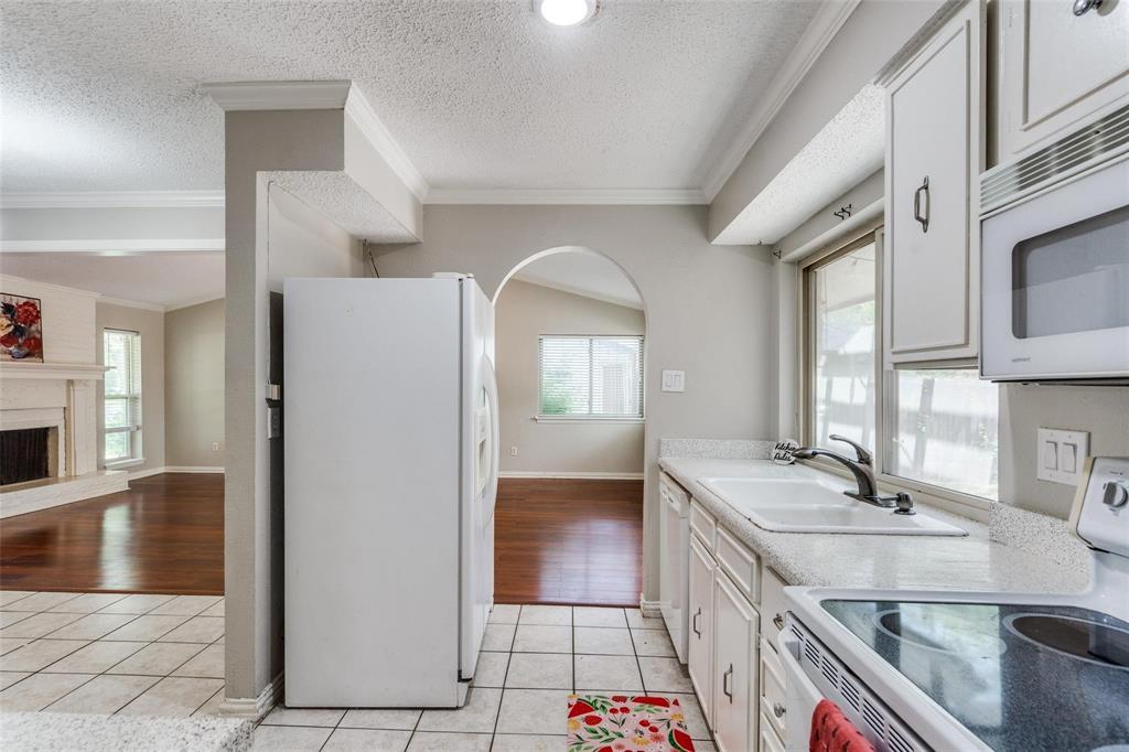 1708 Hendrick Drive Plano, TX 75074 - Photo 8 of 23 a bathroom with a sink a vanity and a large mirror