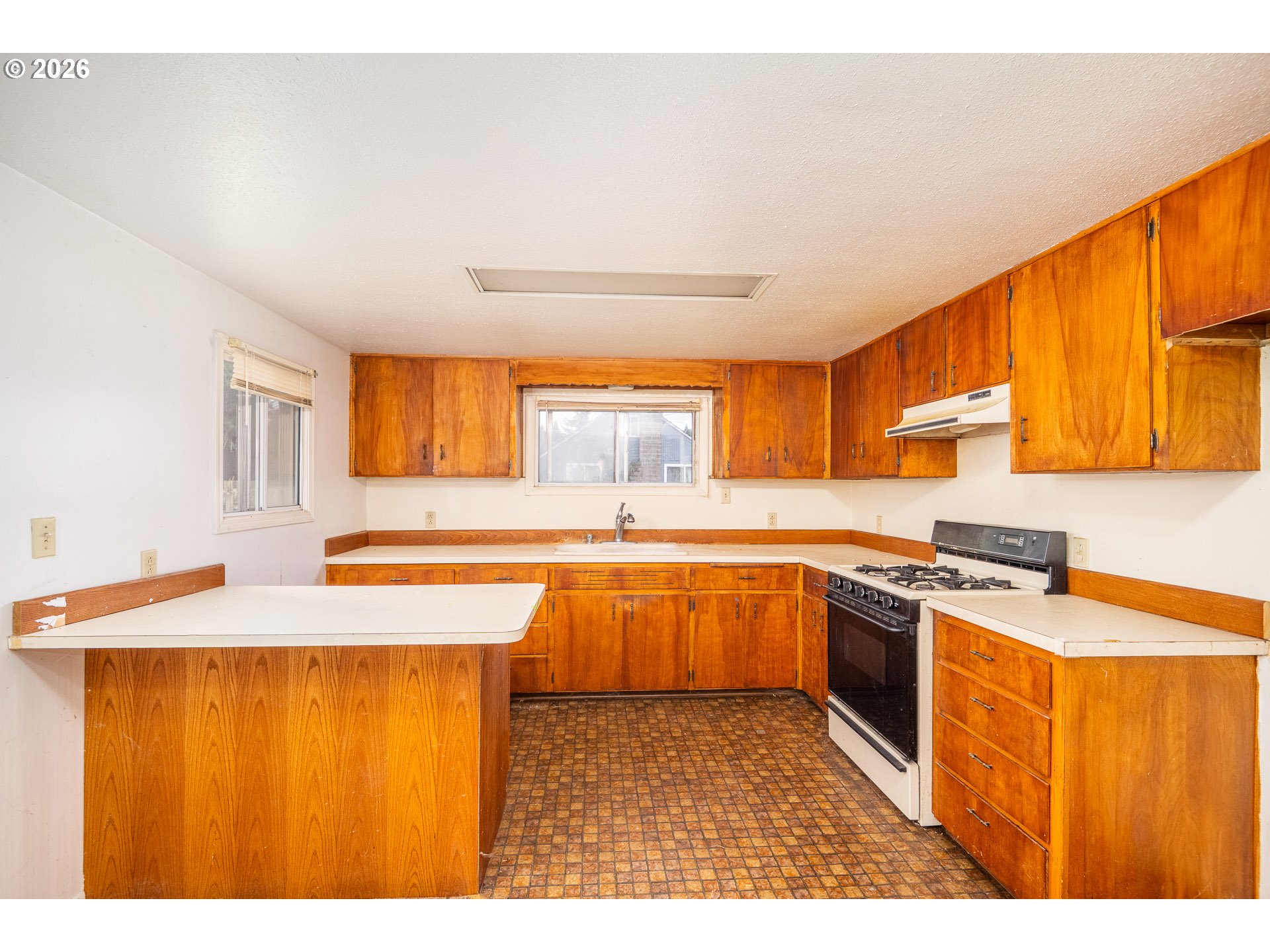 875 South 43rd Street Springfield, OR 97478 - Photo 13 of 22 a kitchen with stainless steel appliances granite countertop a sink stove and refrigerator