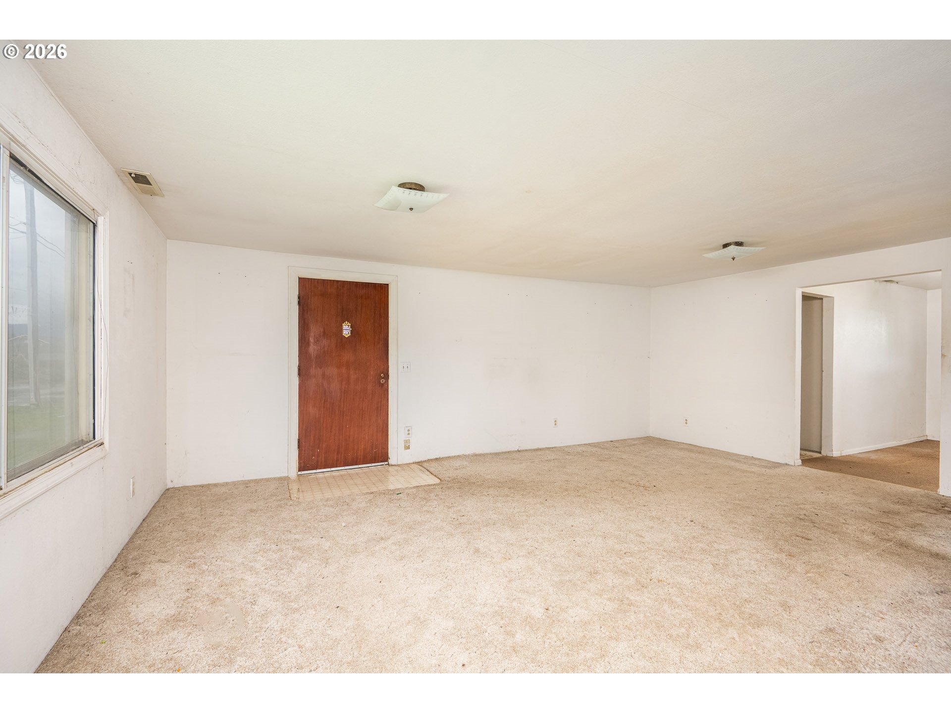 875 South 43rd Street Springfield, OR 97478 - Photo 8 of 22 a view of an empty room with a window