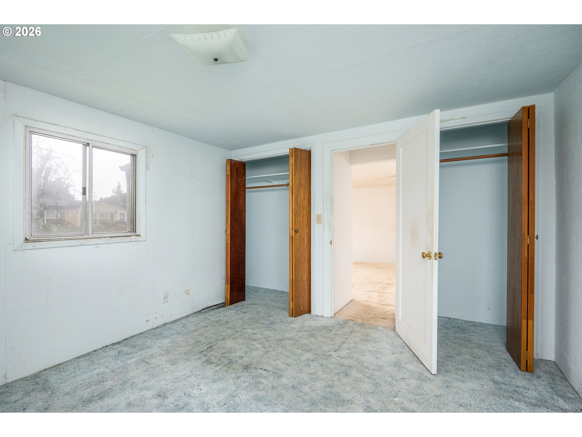 875 South 43rd Street Springfield, OR 97478 - Photo 10 of 22 a view of an empty room with window and closet area
