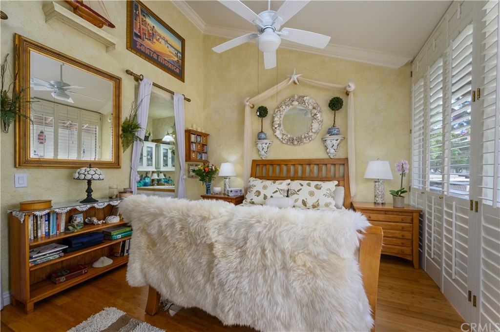 4140 Workman Road, Unit 18 Whittier, CA 90601 - Photo 16 of 35 a bedroom with a bed and a chandelier