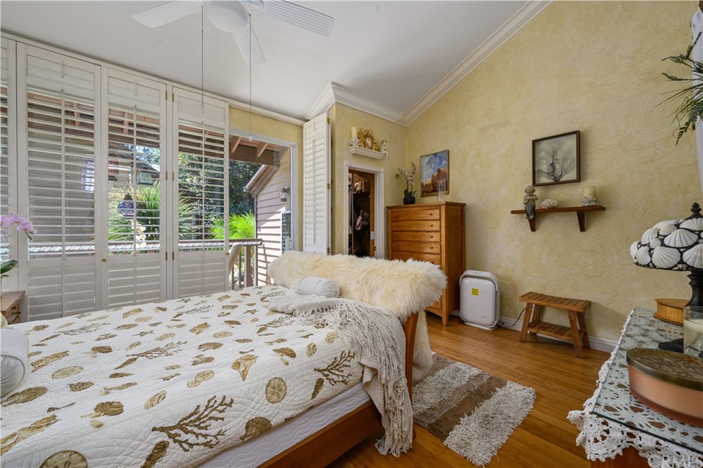 4140 Workman Road, Unit 18 Whittier, CA 90601 - Photo 17 of 35 a bedroom with a bed wooden floor and window