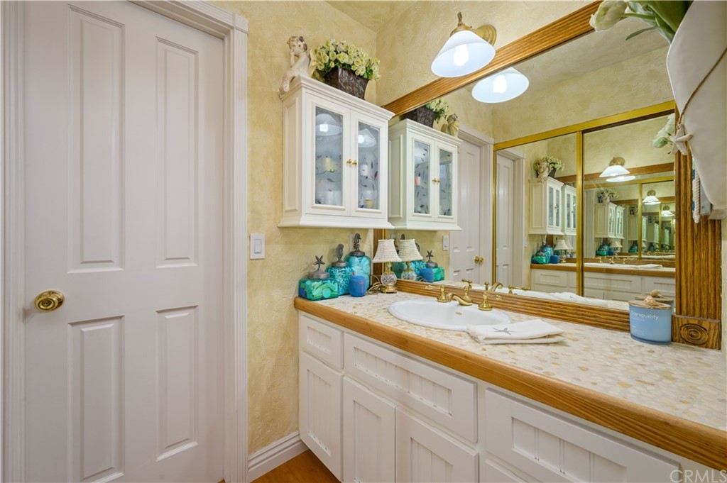 4140 Workman Road, Unit 18 Whittier, CA 90601 - Photo 20 of 35 a bathroom with a sink and a mirror
