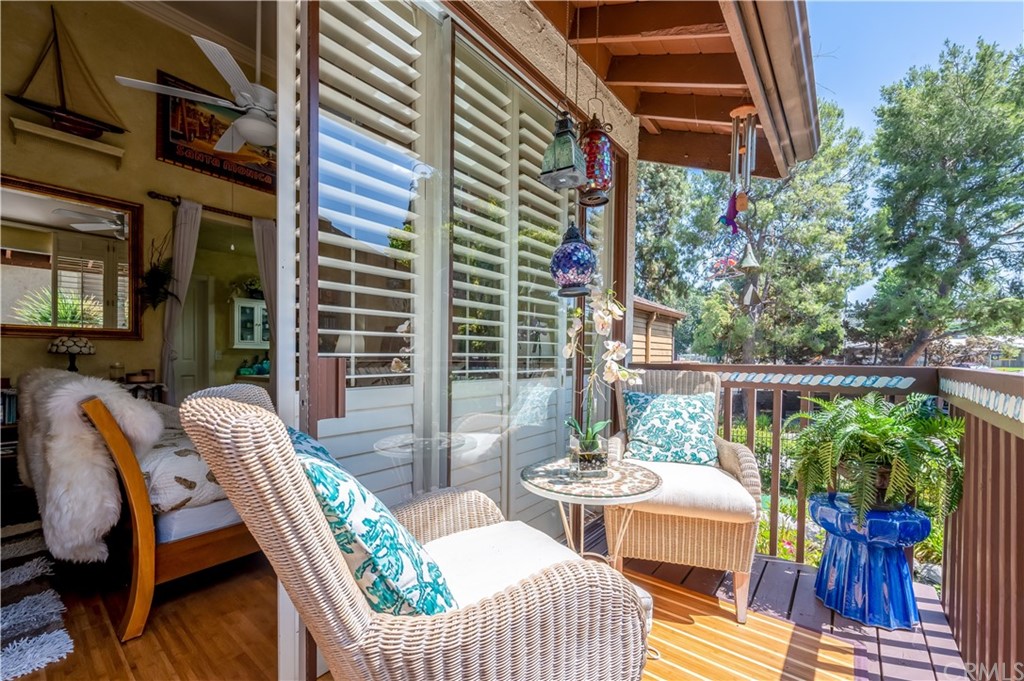4140 Workman Road, Unit 18 Whittier, CA 90601 - Photo 22 of 35 a view of a balcony with two chairs and a potted plant