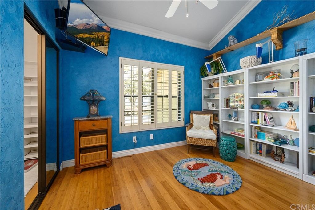 4140 Workman Road, Unit 18 Whittier, CA 90601 - Photo 24 of 35 a living room with furniture and a book shelf
