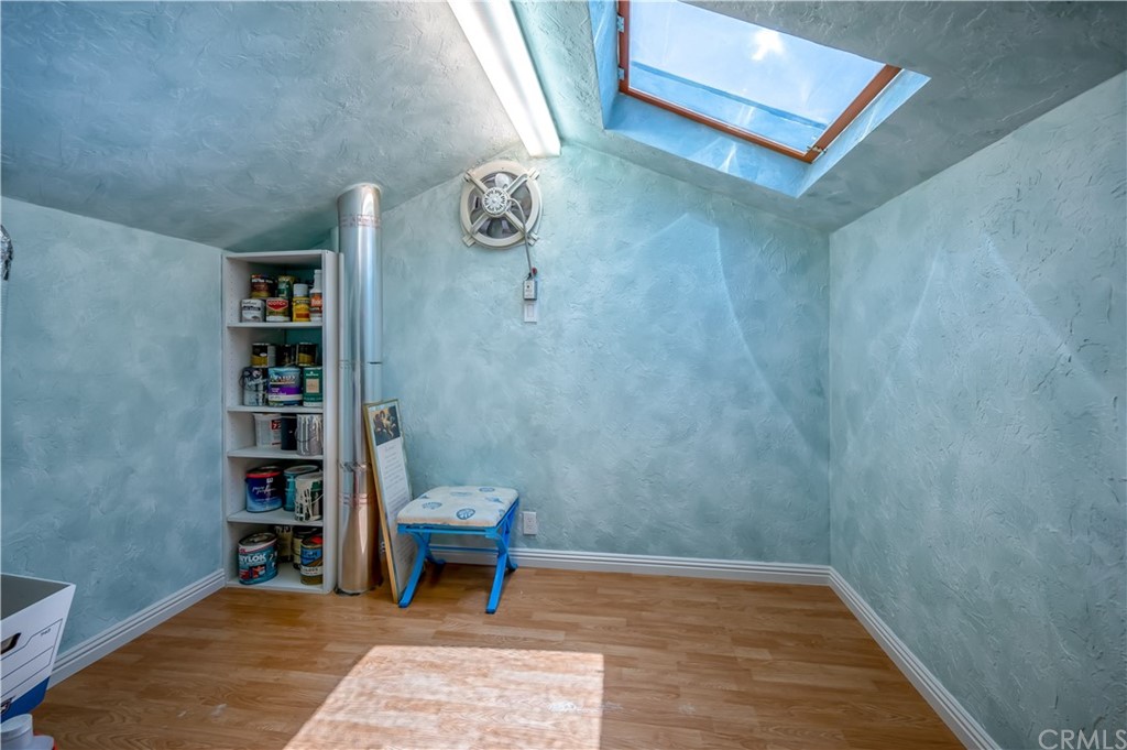 4140 Workman Road, Unit 18 Whittier, CA 90601 - Photo 27 of 35 a view of a livingroom with wooden floor and a book shelf