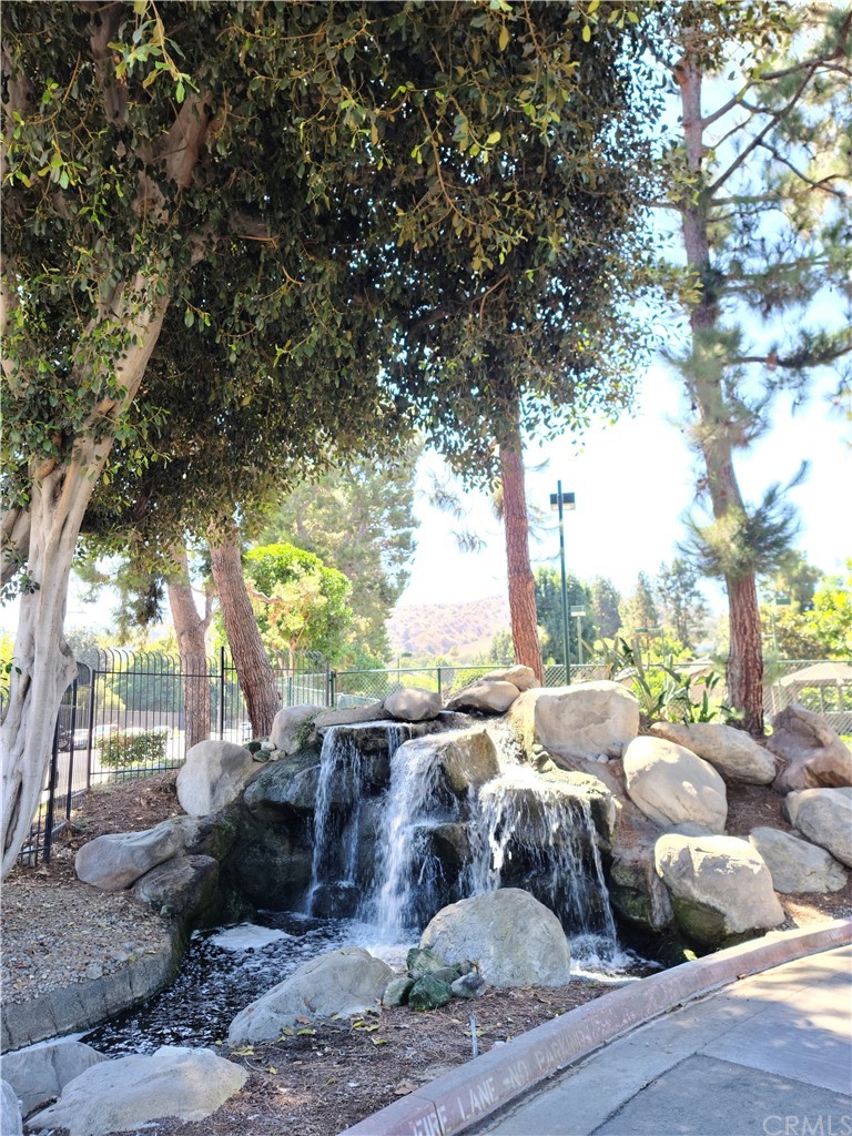 4140 Workman Road, Unit 18 Whittier, CA 90601 - Photo 30 of 35 a living room with furniture and a large tree