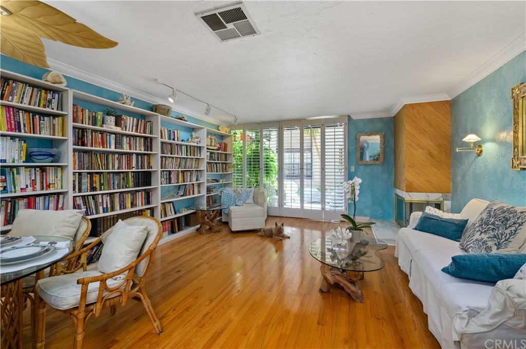 4140 Workman Road, Unit 18 Whittier, CA 90601 - Photo 6 of 35 a living room with furniture and a book shelf