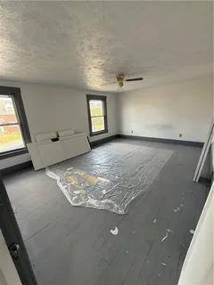 a view of empty room with windows