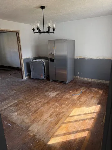 a view of a livingroom with a furniture staircase and a ceiling fan