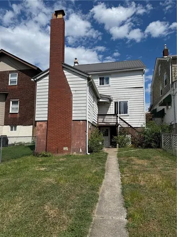 a front view of house with yard
