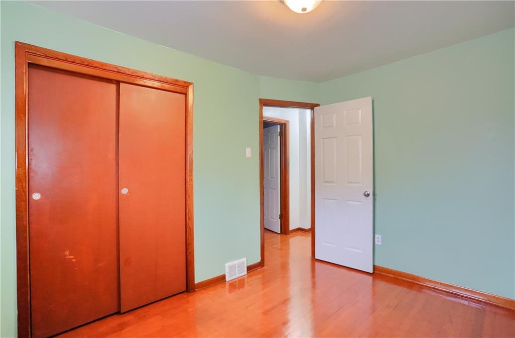 138 Crissinger Road Greensburg, PA 15601 - Photo 14 of 28 an empty room with wooden floor and a window