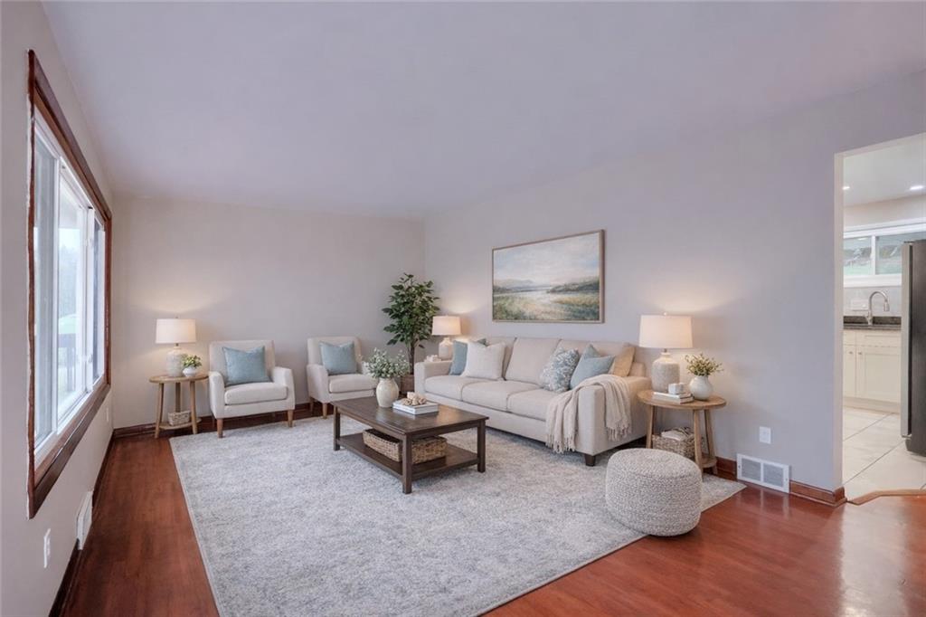 138 Crissinger Road Greensburg, PA 15601 - Photo 4 of 28 a living room with furniture wooden floor and a lamp