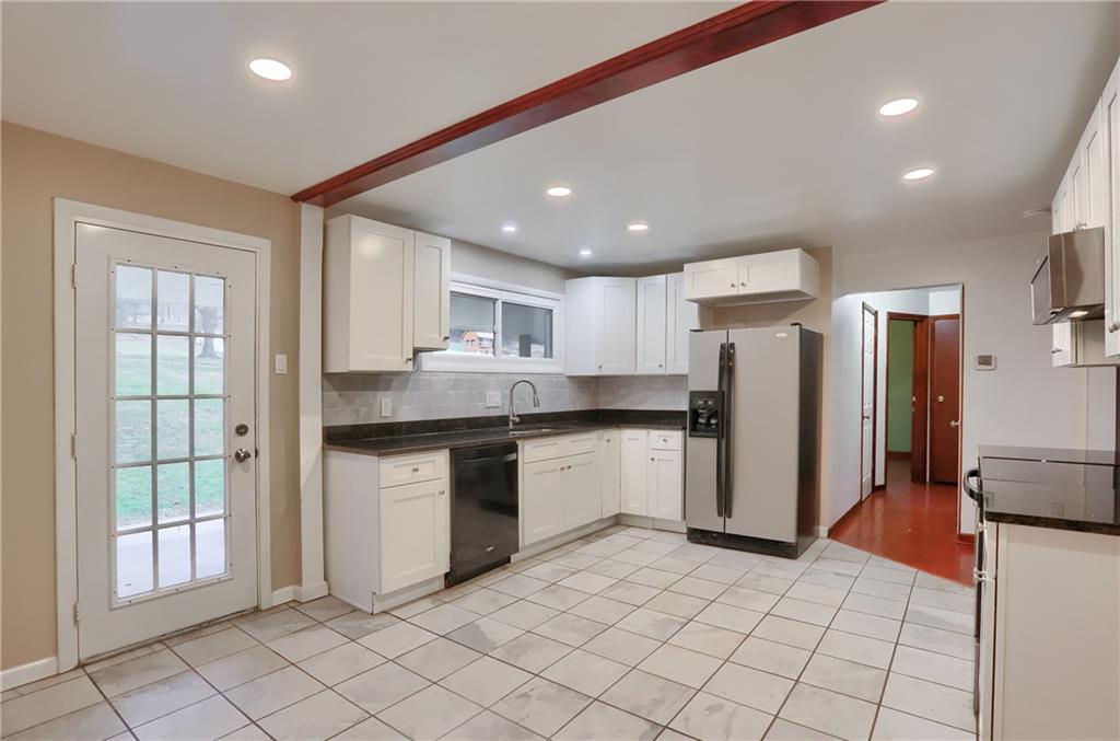 138 Crissinger Road Greensburg, PA 15601 - Photo 8 of 28 a kitchen with stainless steel appliances granite countertop a refrigerator and a sink