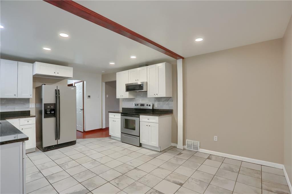 138 Crissinger Road Greensburg, PA 15601 - Photo 10 of 28 a kitchen with stainless steel appliances granite countertop a refrigerator and a sink