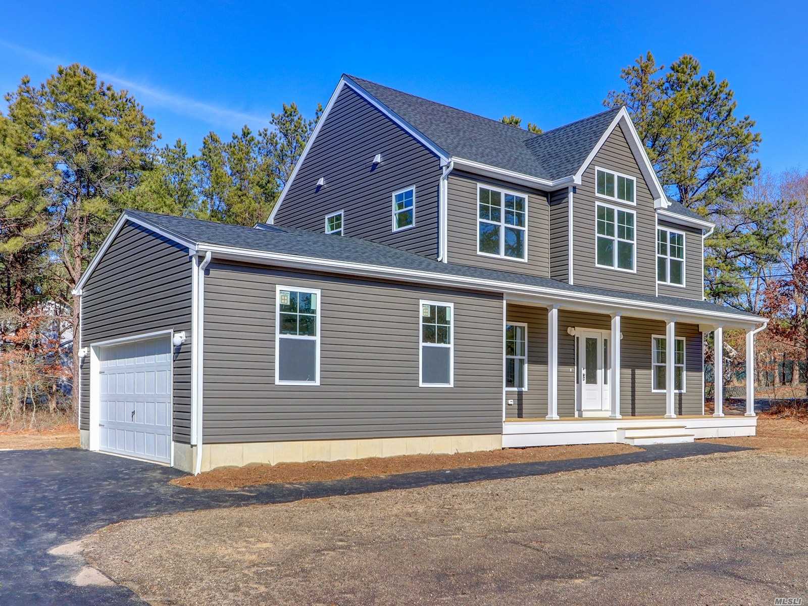 N/c Gull Dip Road Ridge, NY 11961 - Photo 1 of 1 a front view of a house with a garage