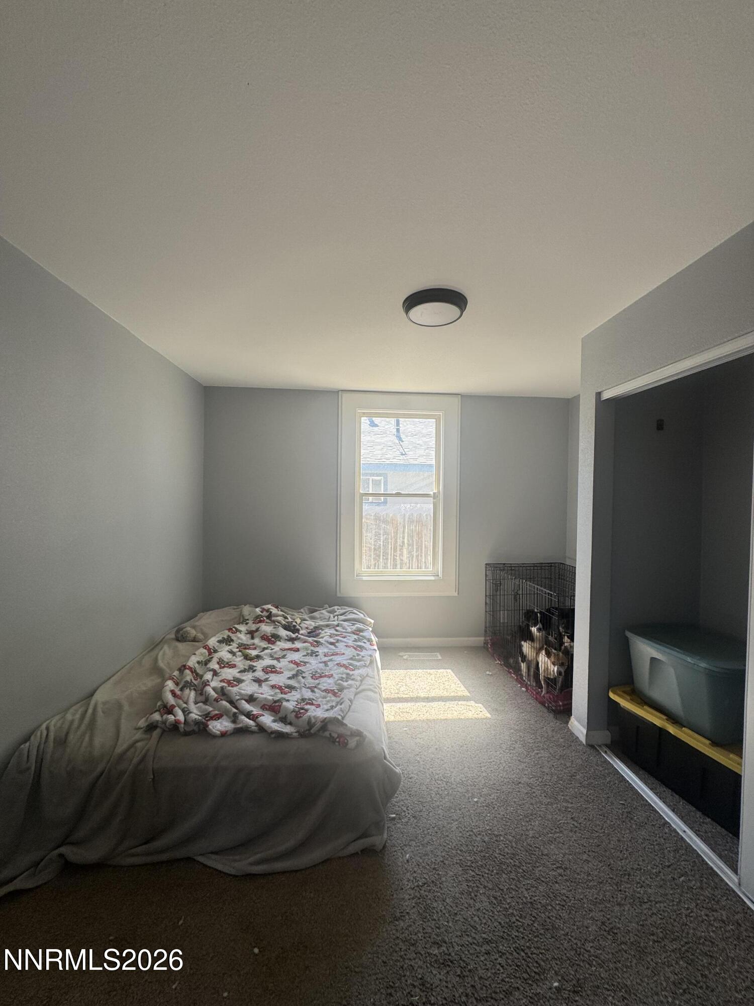 635 Churchill Street Fallon, NV 89406 - Photo 15 of 21 a bedroom with a bed and a window