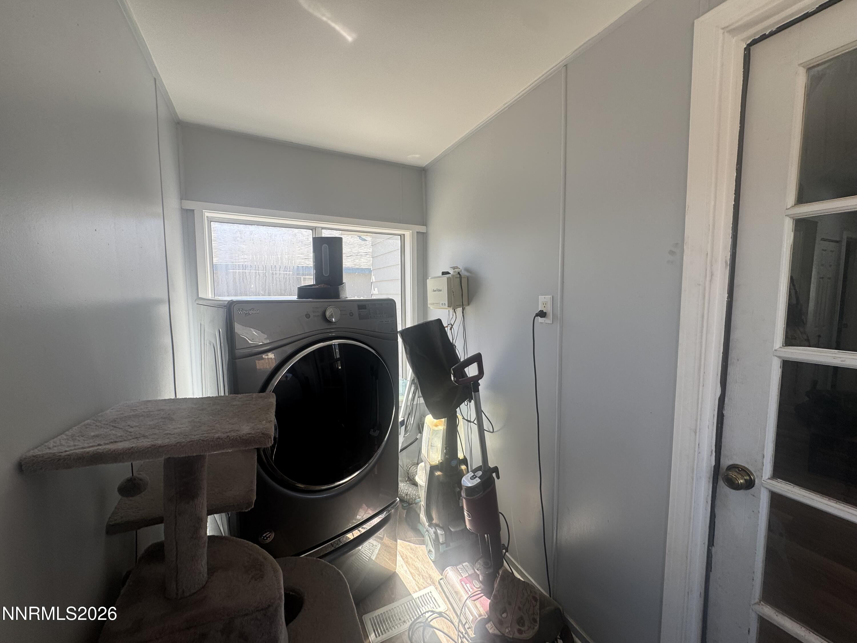 635 Churchill Street Fallon, NV 89406 - Photo 16 of 21 a room with a fireplace and a window