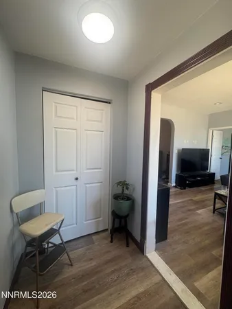 a bathroom with a sink a toilet a mirror and shower