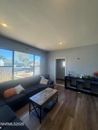 a bedroom with a bed and a tv