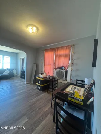 a room with a fireplace and a window