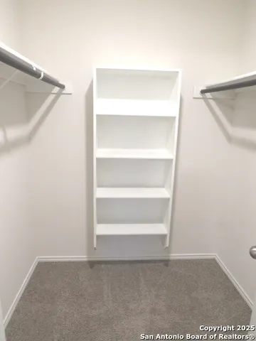 a view of an empty walk in closet