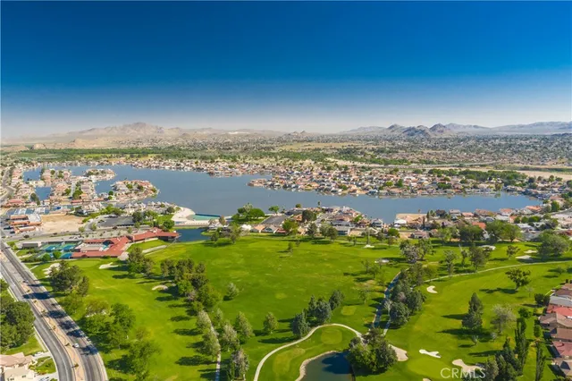 an aerial view of a house with a swimming pool