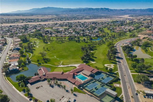 an aerial view of a residential houses with outdoor space