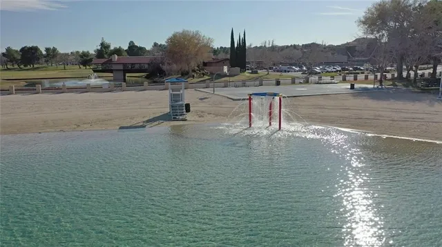 an aerial view of a house with a lake view
