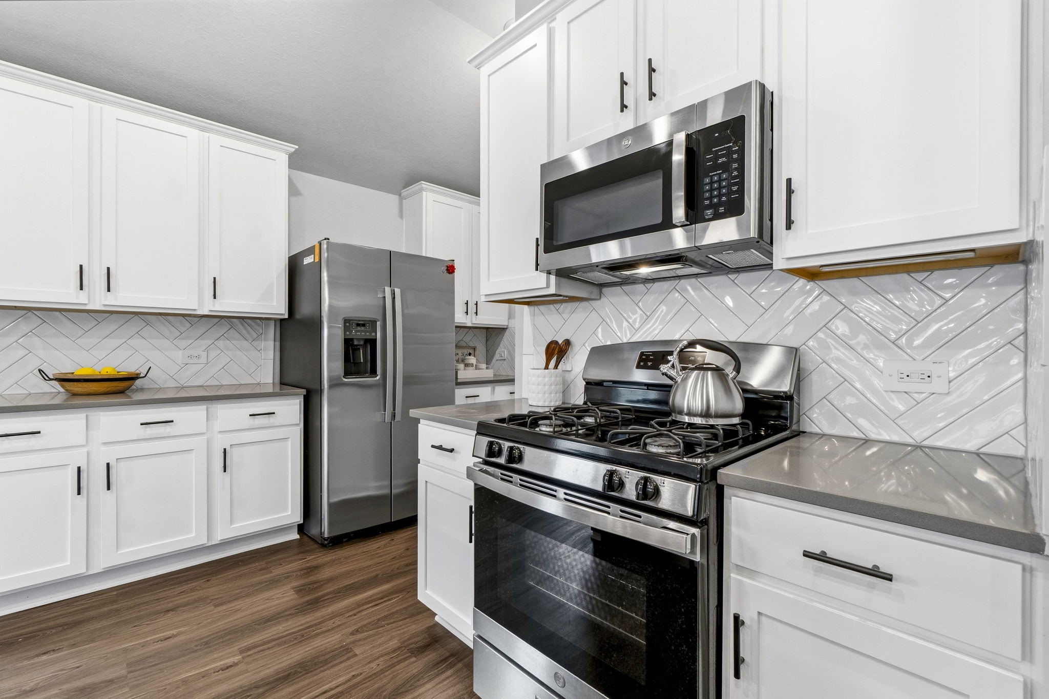 22235 Cardinal Crest Lane New Caney, TX 77357 - Photo 8 of 41 Beautiful kitchen featuring upgraded cabinetry, ample counter space, and an open design that flows seamlessly into the dining and family room.