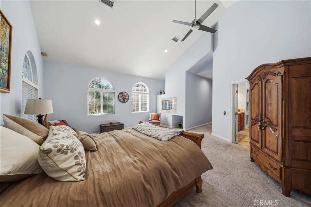 27312 Little Bear Road Lake Arrowhead, CA 92352 - Photo 28 of 47 a bedroom with bed and wooden floor