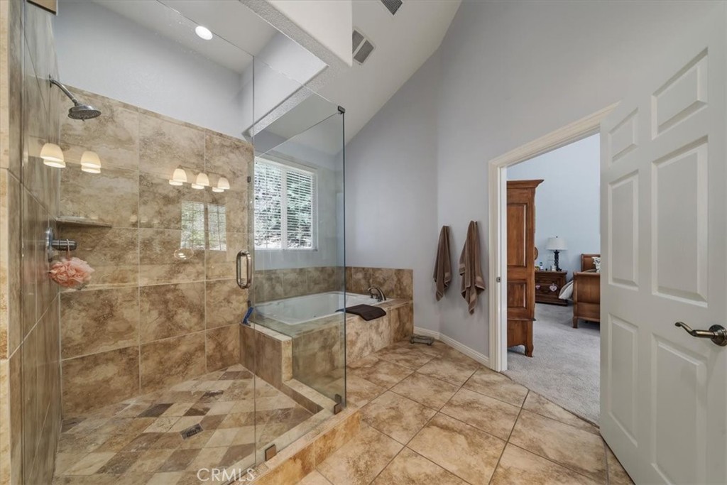 27312 Little Bear Road Lake Arrowhead, CA 92352 - Photo 31 of 47 a bathroom with shower and bathtub