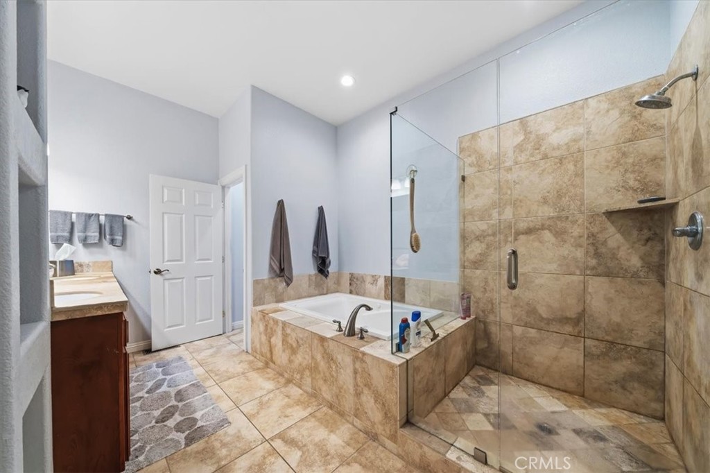 27312 Little Bear Road Lake Arrowhead, CA 92352 - Photo 36 of 47 a bathroom with a bathtub and a shower